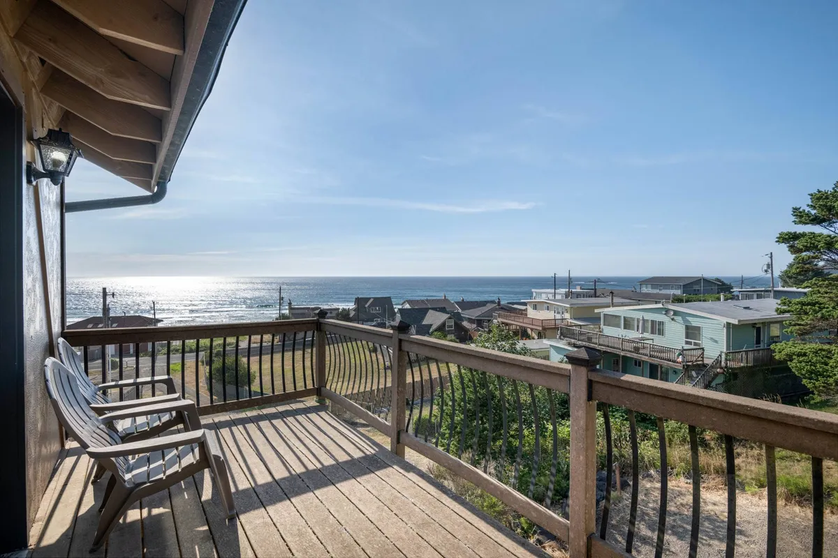 This view-focused image features deck chairs positioned to face the expansive ocean view, with railings framing the peaceful outdoor space. It emphasizes relaxation, reading, and soaking in sunsets or stargazing, offering a tranquil retreat for all ages.